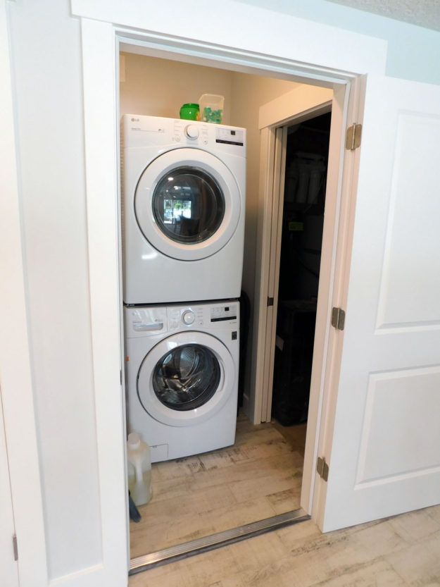 stacked dryer and washer laundry space by pro worx construction in utah