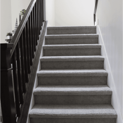 complete basement staircase with custom rails during a basement remodel in sandy utah by pro worx construction