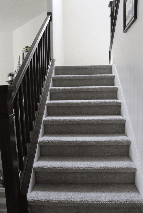 complete basement staircase with custom rails during a basement remodel in sandy utah by pro worx construction