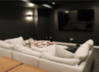 complete home theater during basement finishing project with soft lighting by pro worx construction in utah