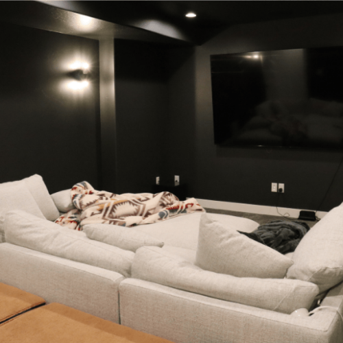 complete home theater during basement finishing project in alpine with soft lighting by pro worx construction in utah