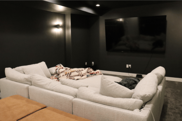 complete home theater during basement finishing project with soft lighting by pro worx construction in utah