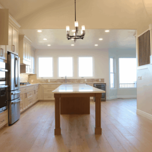 riverton utah basement finishing project with full kitchen with mix of led lights and main lights by pro worx construction in utah