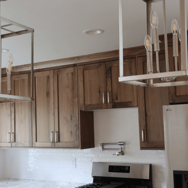 trendy light fixtures for kitchen remodeled in herriman, utah by pro worx construction