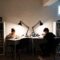 Two boys with bookshelves as dividers