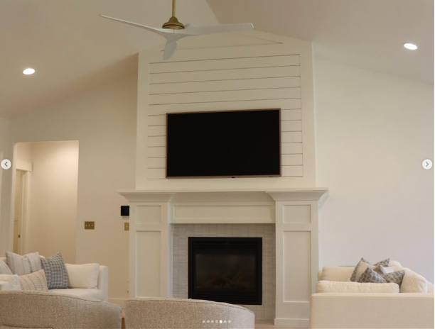 basement living area with fireplace and wall tv in utah by proworx construction